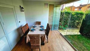 a table with chairs and blue dishes on a patio at Pura Vida in Lepe