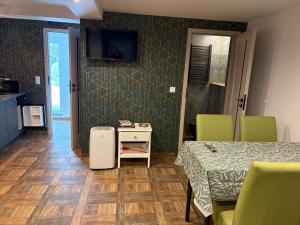 a room with a bed and a table and chairs at Agrobiskupin Kaczmarek 2 in Gąsawa