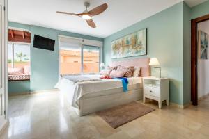 a bedroom with a bed and a ceiling fan at Villa Cornelia in Adeje +36 photos