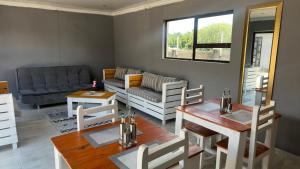 a living room with a couch and a table at K K K Guesthouse in Secunda