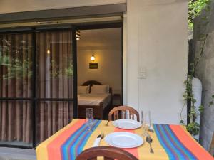 a table with a colorful table cloth on it at The Coast Haven in Tangalle