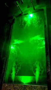 a green light on top of a glass floor at PANORÂMIC LUXO EXCLUSIVe in Santa Cruz Cabrália