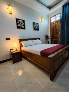 a bedroom with a large bed and a window at Serengeti space resort in Bunda