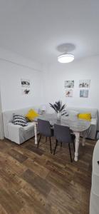 a living room with a table and a couch at La vagoneta in Cala