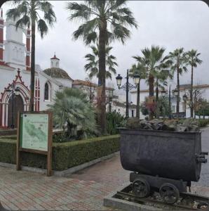 a large trash can sitting in front of a building at La vagoneta in Cala