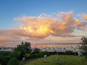 a view of the water with a cloudy sky at Atlantic Dependance Travemünde in Travemünde