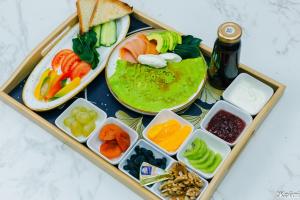 a tray of food with different types of food at Zhaily Hotel in Semey