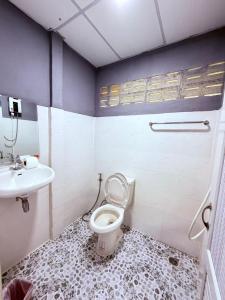 a bathroom with a toilet and a sink at Khao Sok River Canoe&Resort in Khao Sok National Park +138 photos