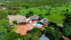 an aerial view of a house with a swimming pool at Falcon Lodge Bela in Bela-Bela