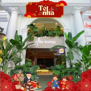 a store front of a shopping mall with figurines in front at Joi Boutique Bãi Trước in Vung Tau