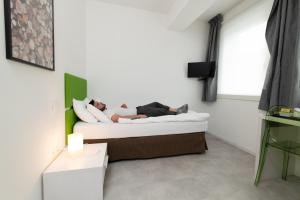 En eller flere senge i et værelse på Le Vette