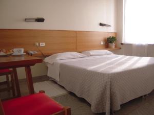Voodi või voodid majutusasutuse Albergo Bianchi Stazione toas