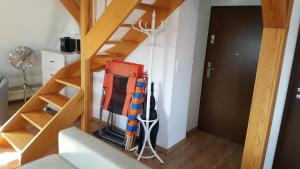 a room with a staircase and a room with a ladder at Baltic Sea in Jastarnia