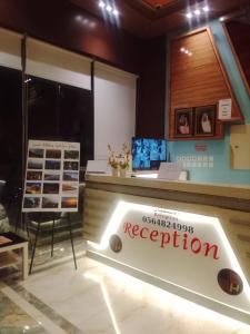 a store with aption sign in the middle of a room at شقق همسات المخدومة in Khamis Mushayt