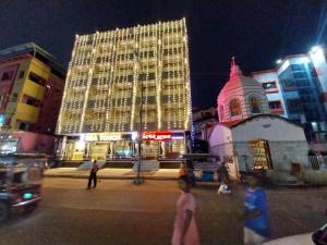 a large building is lit up at night at Hotel Sea Touch in Digha