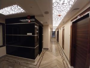 a hallway of a building with a door and a hallwayngth at Hotel Sea Touch in Digha