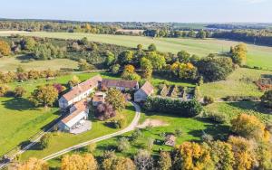 an aerial view of a house in a field at La Garencière - Les Fleurs in Champfleur