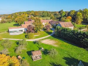 an aerial view of a house with a yard at La Garencière - Les Fleurs in Champfleur +20 photos