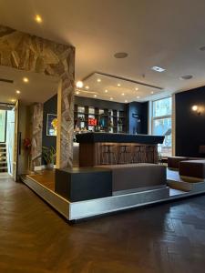 a lobby with a bar in a building at S&A Vondel Park Hotel in Amsterdam