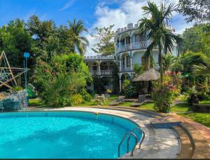 Bazén v ubytování Kokosnuss Garden Resort nebo v jeho okolí