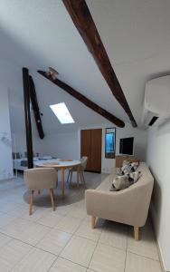 a living room with a couch and a table at Ascona, Casa Collegio - im Zentrum, am See Lago Maggiore in Ascona