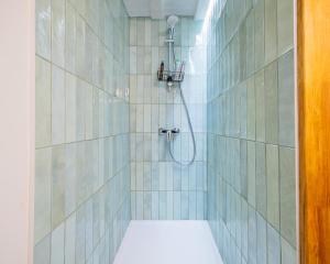 a bathroom with a shower with a toilet in it at La Garencière - La Petite Maison in Champfleur