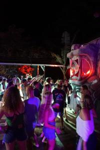 a crowd of people walking around at night at Raindance Hostel in Santa Cruz
