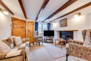 a living room with a couch and a fireplace at 3 Bed in Whitby oc-w009 in Whitby