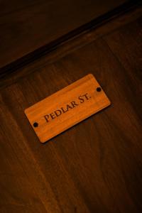 a wooden sign on a table with the word redefined at The Urban Stay in Galle