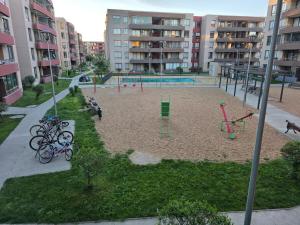 an empty playground with bikes parked in a park at Comfort, Safety, and Connectivity in Chillán