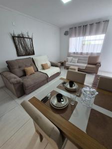 a living room with a couch and a table at Casa Marzenta in Petrolina