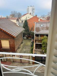a view of a city from a balcony at Renovated prestige apartment in Aubervilliers