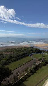 an aerial view of the beach and the ocean at L’Escalier Cabanas 510 in Amanzimtoti