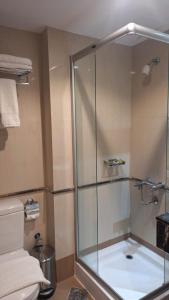 a bathroom with a shower and a toilet at Sunrise Ajyad Hotel in Mecca +28 photos