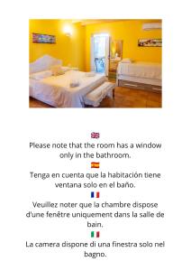 una camera con due letti e una camera con pareti gialle di Turismo Rural Biniati des Pi a Sant Lluís