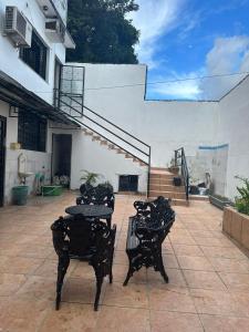 a group of tables and chairs on a patio at Hotel Araras in Manaus