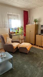 a living room with a couch and a table at Ferienwohnung Juttchen in Roßleben