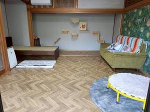 a living room with a couch and a table at つるふく in Misaki