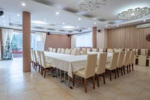 a conference room with a white table and chairs at Centrum Green Hill Business & SPA in Wisła +58 photos