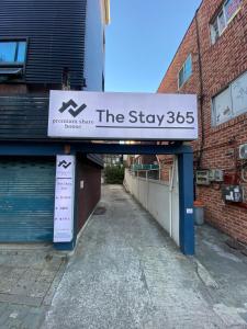 a sign that says the stay on a building at 더스테이365 스탠다드 in Seoul