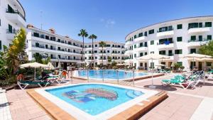 a large swimming pool in front of a hotel at Las Faluas by Youroom in Playa del Ingles
