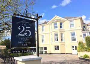 a sign in front of a house at The 25 Boutique B&B - Adults Only in Torquay