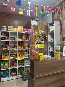 a store with a counter with food on it at Hotel Araras in Manaus
