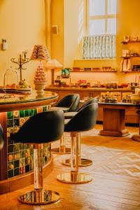 a barber shop with chairs and a counter at Wilde Vienna Fleischmarkt in Vienna