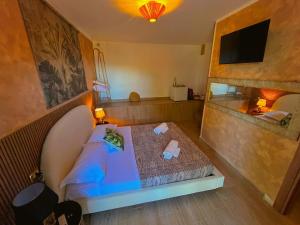 a small bedroom with a bed in a room at OIKOS Guesthouse & Rooftop in Suio +35 photos