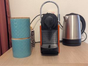 a blender and a coffee pot on a table at Chez Marie et Hugo in Brest