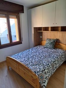 En eller flere senge i et værelse på Casa MAGNA