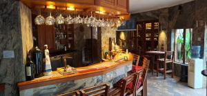 a bar in a restaurant with bottles of wine at Green Haven Guest Lodge in Pretoria