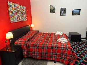 En eller flere senge i et værelse på B&B Villa Giglio