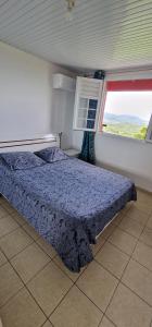 En eller flere senge i et værelse på HARMONY Appart Type Penthouse avec vue imprenable